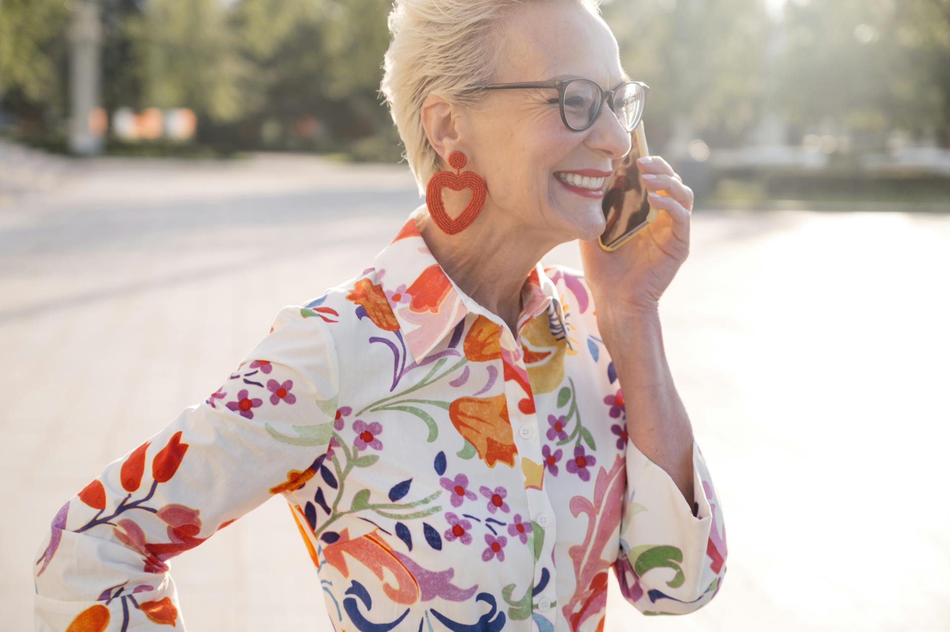 Linda, 74, senior woman laughing on the phone with her Social Circle friends